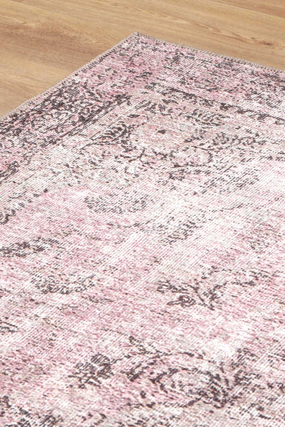 Experience luxury and practicality with the Germain Rose Rug. Its distressed medallion design adds sophistication to any space while its stain and water-resistant properties make it easy to clean. Plus, it's machine washable for added convenience.