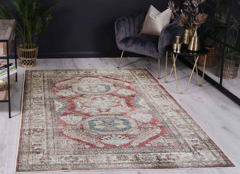 The Traditional Kazak Ruby rug is a stunning addition to any home, with its rich red hues and intricate pattern. It is designed to withstand heavy foot traffic and spills, with its water and stain-resistant properties and machine washable construction. Made with recycled cotton and featuring anti-allergen technology, this rug is both eco-friendly and practical.