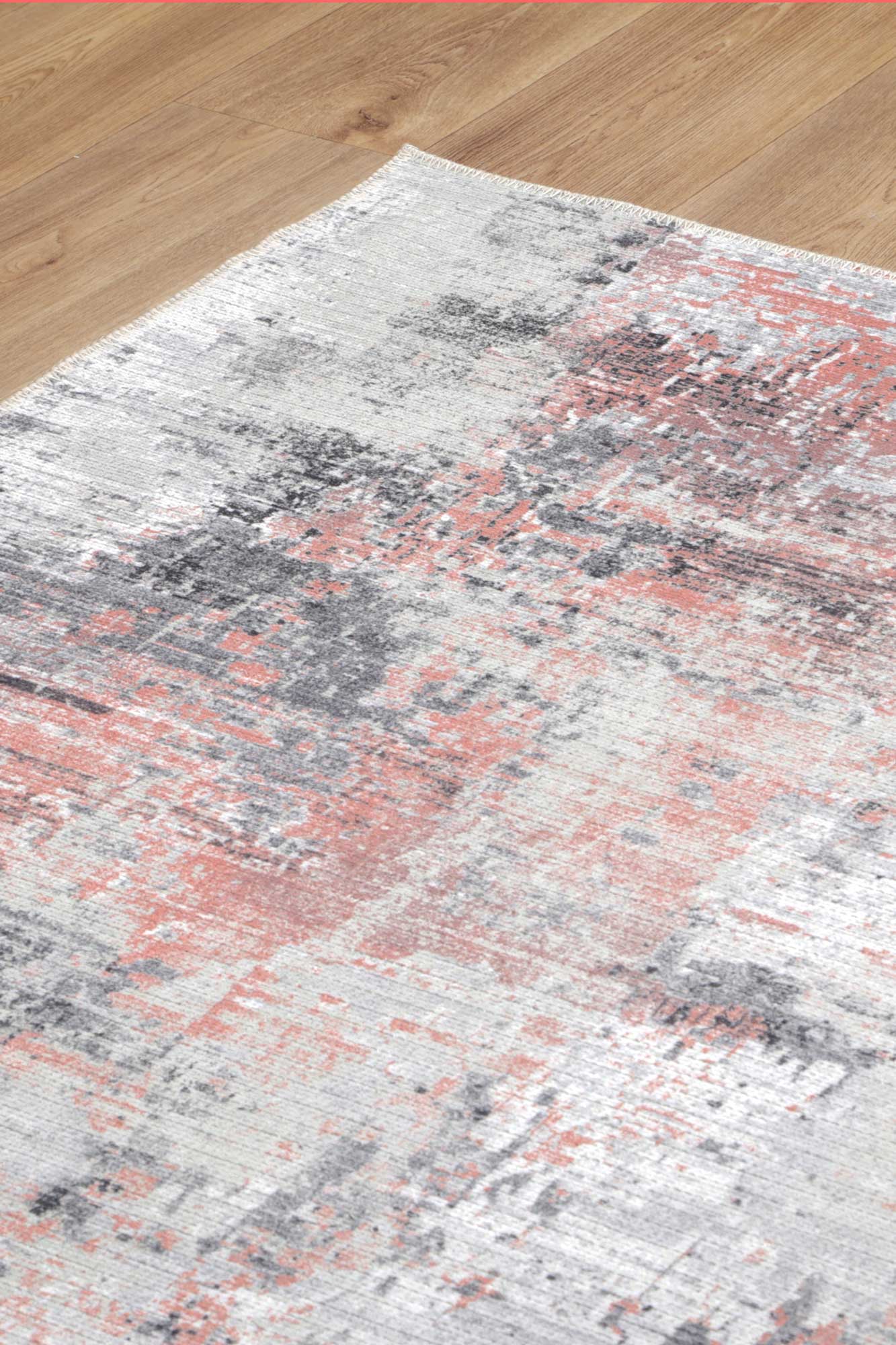 Add comfort and warmth to your living room or bedroom with the Abstract Celine Blush Rug. Stain and water-resistant with NanoWipe technology, machine washable, and made from recycled cotton.