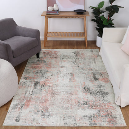 Contemporary Abstract Celine Blush Rug for indoor use with pink, grey, and cream abstract design made from recycled cotton. Stain and water-resistant with NanoWipe technology, machine washable, and anti-allergen.