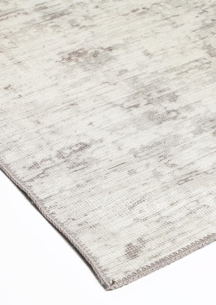 Enjoy easy maintenance and style with the Vintage Crown collection rug. Liquid-repellent with NanoWipe technology for durability and machine washable convenience. Grey runner with abstract design, made from recycled cotton.